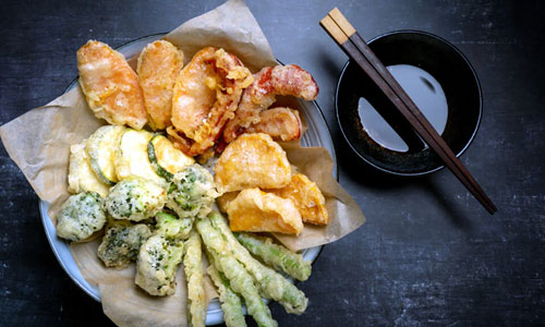 Crispy golden Tempura Veg Classic vegetables on a plate
